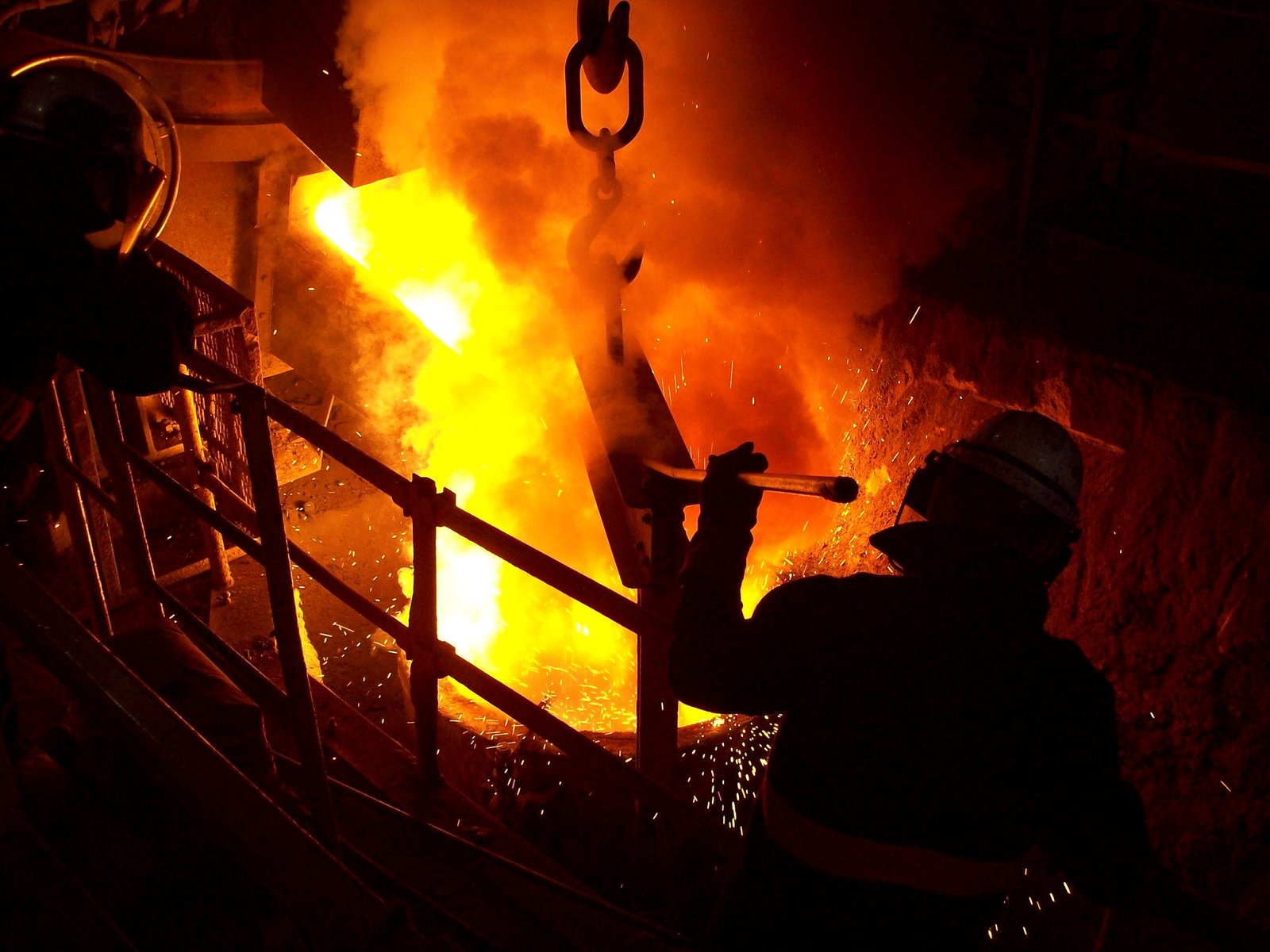 Molten metal being poured at a smelter